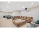 Finished basement featuring a lounge area with comfortable seating and a kitchenette at 3347 Alamance Dr, Raleigh, NC 27609