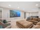 Spacious basement featuring a large screen TV and kitchenette area with ping pong table at 3347 Alamance Dr, Raleigh, NC 27609
