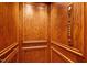 This home includes a wood paneled residential elevator with a control panel at 3347 Alamance Dr, Raleigh, NC 27609