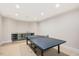 A game room features a ping pong table and a kitchenette with a beverage fridge at 3347 Alamance Dr, Raleigh, NC 27609