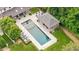 Stunning backyard featuring a pool, cabana, lounge seating, and immaculately maintained landscaping at 3347 Alamance Dr, Raleigh, NC 27609