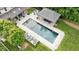 Backyard oasis with a sparkling pool, lounge chairs, and an inviting outdoor cabana at 3347 Alamance Dr, Raleigh, NC 27609