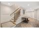 An entry staircase features wood treads, a wood handrail, and decorative tile flooring at 3347 Alamance Dr, Raleigh, NC 27609