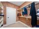 This walk-in closet features custom shelving and unique wallpaper at 3347 Alamance Dr, Raleigh, NC 27609