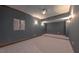 Finished basement with neutral carpeting, recessed lighting, and dimmable sconces at 3408 Mount Pisgah Way, Cary, NC 27519