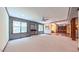 Large finished basement with neutral carpeting, built-in shelves, and plenty of natural light at 3408 Mount Pisgah Way, Cary, NC 27519