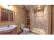This full bathroom includes custom cabinets, tile shower, and modern fixtures at 3408 Mount Pisgah Way, Cary, NC 27519