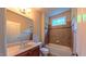 Well-lit bathroom has a vanity, toilet, and shower/tub combination at 3408 Mount Pisgah Way, Cary, NC 27519