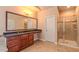 Stylish bathroom featuring a large vanity, glass shower, and tile flooring at 3408 Mount Pisgah Way, Cary, NC 27519