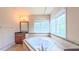 Bright bathroom with a tiled deck tub framed by windows and decorative lighting at 3408 Mount Pisgah Way, Cary, NC 27519
