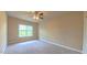 Bright bedroom featuring neutral carpet and paint, and a ceiling fan at 3408 Mount Pisgah Way, Cary, NC 27519