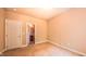 A cozy bedroom is staged with plush carpet and cream colored walls at 3408 Mount Pisgah Way, Cary, NC 27519