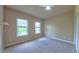 Comfortable bedroom features plush carpeting, two windows providing natural light at 3408 Mount Pisgah Way, Cary, NC 27519