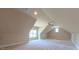 A bonus room with carpet and multiple windows at 3408 Mount Pisgah Way, Cary, NC 27519