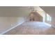 Large, carpeted bonus room with a ceiling fan and staircase at 3408 Mount Pisgah Way, Cary, NC 27519