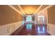 Elegant dining room featuring hardwood floors, decorative molding, and a chandelier for sophisticated entertaining at 3408 Mount Pisgah Way, Cary, NC 27519