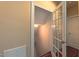 Bright hallway with view of interior door, carpeted staircase, and a hall closet at 3408 Mount Pisgah Way, Cary, NC 27519