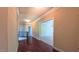 Hallway with hardwood floors and crown molding, leading to other rooms at 3408 Mount Pisgah Way, Cary, NC 27519