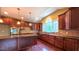 Spacious kitchen features custom wood cabinets, stainless steel appliances, and granite countertops at 3408 Mount Pisgah Way, Cary, NC 27519