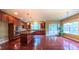 Expansive kitchen features a spacious island, stainless steel appliances, and warm cabinetry at 3408 Mount Pisgah Way, Cary, NC 27519