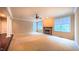 Bright living room with large windows and a fireplace, perfect for relaxing and unwinding at 3408 Mount Pisgah Way, Cary, NC 27519