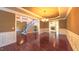 Expansive living room with hardwood floors, and a fireplace, perfect for gatherings and cozy evenings at 3408 Mount Pisgah Way, Cary, NC 27519
