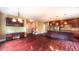 Open floor plan showcases hardwood floors, connecting the kitchen, dining, and living areas seamlessly at 3408 Mount Pisgah Way, Cary, NC 27519
