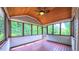 Relaxing screened porch with wooded views and vaulted wood ceiling at 3408 Mount Pisgah Way, Cary, NC 27519