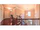 Beautiful staircase with wood railings and iron spindles lead to the second floor at 3408 Mount Pisgah Way, Cary, NC 27519