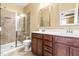 Bathroom featuring a glass shower and double sink at 364 Skymont Dr, Holly Springs, NC 27540