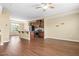 Open-concept living space with hardwood floors, recessed lighting, and a kitchen featuring stainless steel appliances at 364 Skymont Dr, Holly Springs, NC 27540