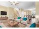 Living space with modern furniture and decor is virtually staged and features an island with a dishwasher at 364 Skymont Dr, Holly Springs, NC 27540
