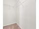 A walk-in closet is displayed with shelving and carpeted floor at 364 Skymont Dr, Holly Springs, NC 27540