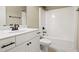 Bathroom featuring vanity with sink, mirror, toilet, and bathtub with shower and bronze fixtures at 37 Meadow Oaks Cir, Smithfield, NC 27577