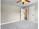 Bedroom featuring neutral carpet, a ceiling fan, and doors leading to bathroom and hallway at 37 Meadow Oaks Cir, Smithfield, NC 27577