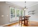 Cozy breakfast nook with natural light, hardwood floors, and modern lighting at 37 Meadow Oaks Cir, Smithfield, NC 27577