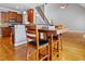 Open concept dining area adjacent to the kitchen, featuring wood floors and staircase views at 37 Meadow Oaks Cir, Smithfield, NC 27577