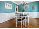 Elegant dining room with wainscoting, hardwood floors, modern lighting, and stylish decor at 37 Meadow Oaks Cir, Smithfield, NC 27577