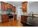 Kitchen features stainless steel microwave, range, countertops, and tile backsplash at 37 Meadow Oaks Cir, Smithfield, NC 27577