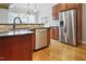 Kitchen area features stainless steel refrigerator, dishwasher, sink, and granite counters at 37 Meadow Oaks Cir, Smithfield, NC 27577