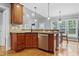 Kitchen area with stainless steel dishwasher, sink, granite counters, and view into an adjacent living space at 37 Meadow Oaks Cir, Smithfield, NC 27577
