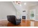 Cozy living room with a fireplace, hardwood floors, and a view of the backyard at 37 Meadow Oaks Cir, Smithfield, NC 27577