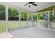 Screened porch with ceiling fan and screens with views of the backyard at 37 Meadow Oaks Cir, Smithfield, NC 27577