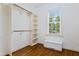 Walk-in closet with custom shelving and window for natural light at 37 Meadow Oaks Cir, Smithfield, NC 27577
