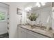 Elegant bathroom with double vanity, granite countertops and decorative plants, creating a spa-like atmosphere at 3908 Sterling Ridge Ln, Durham, NC 27707