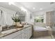 A serene bathroom offers a soaking tub, dual vanity, and tiled shower at 3908 Sterling Ridge Ln, Durham, NC 27707