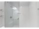 Modern bathroom featuring a glass enclosed shower with subway tile and convenient shelving at 3908 Sterling Ridge Ln, Durham, NC 27707