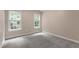 A serene bedroom featuring carpet, natural light, and ample space, creating a comfortable retreat at 3908 Sterling Ridge Ln, Durham, NC 27707