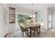 Cozy breakfast nook features built-in shelving, a window with backyard views, and modern lighting at 3908 Sterling Ridge Ln, Durham, NC 27707