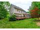 A charming two-story home boasts a large deck and screened in porch at 3908 Sterling Ridge Ln, Durham, NC 27707